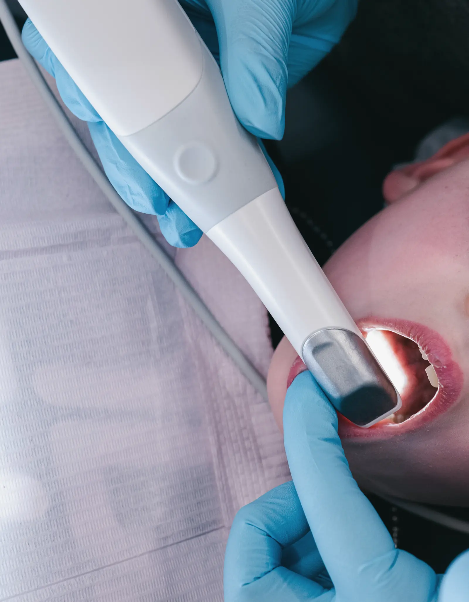 Dr. Kat taking a digital scan of a patient's teeth with a handheld intraoral scanner